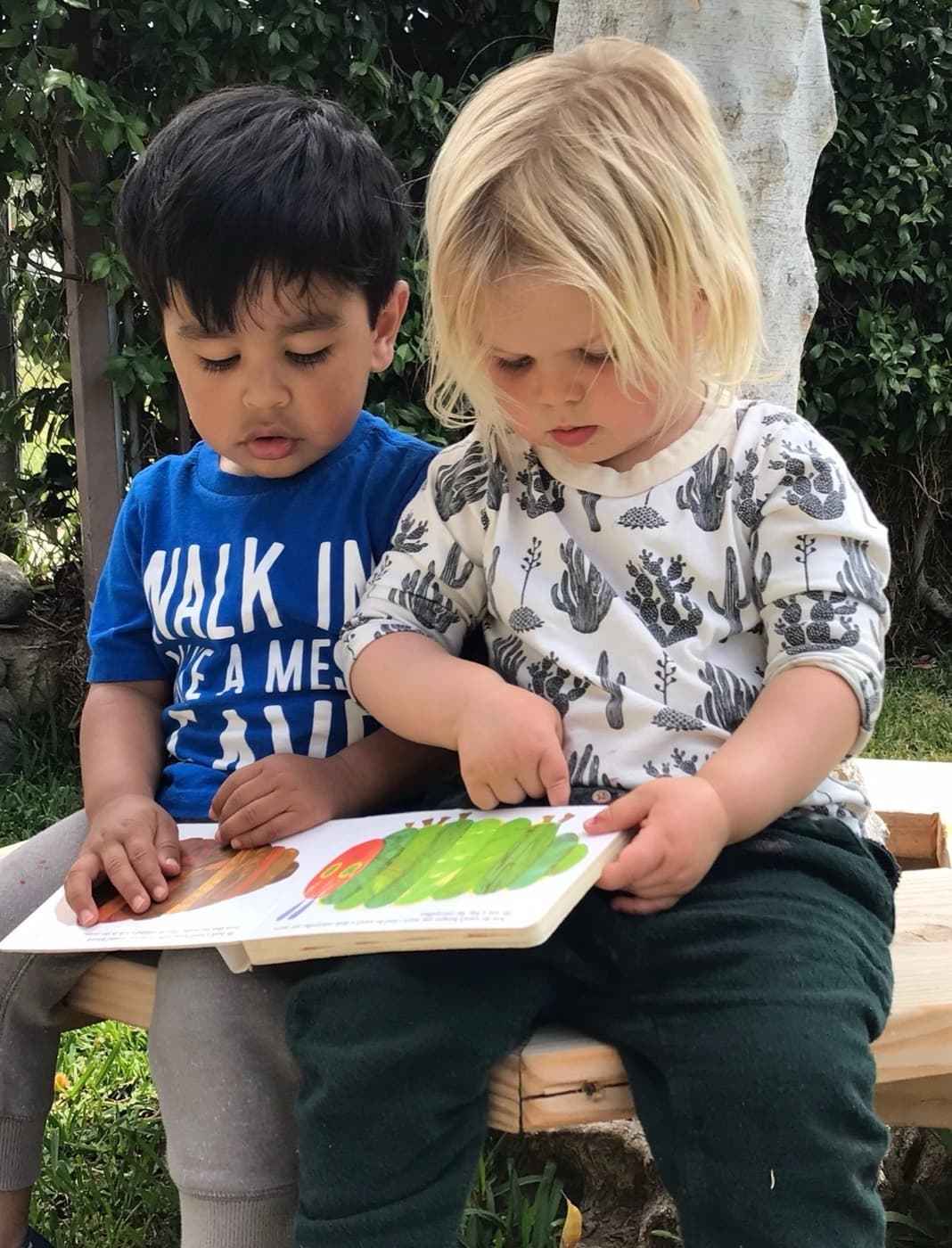 Reading a caterpillar picture book together