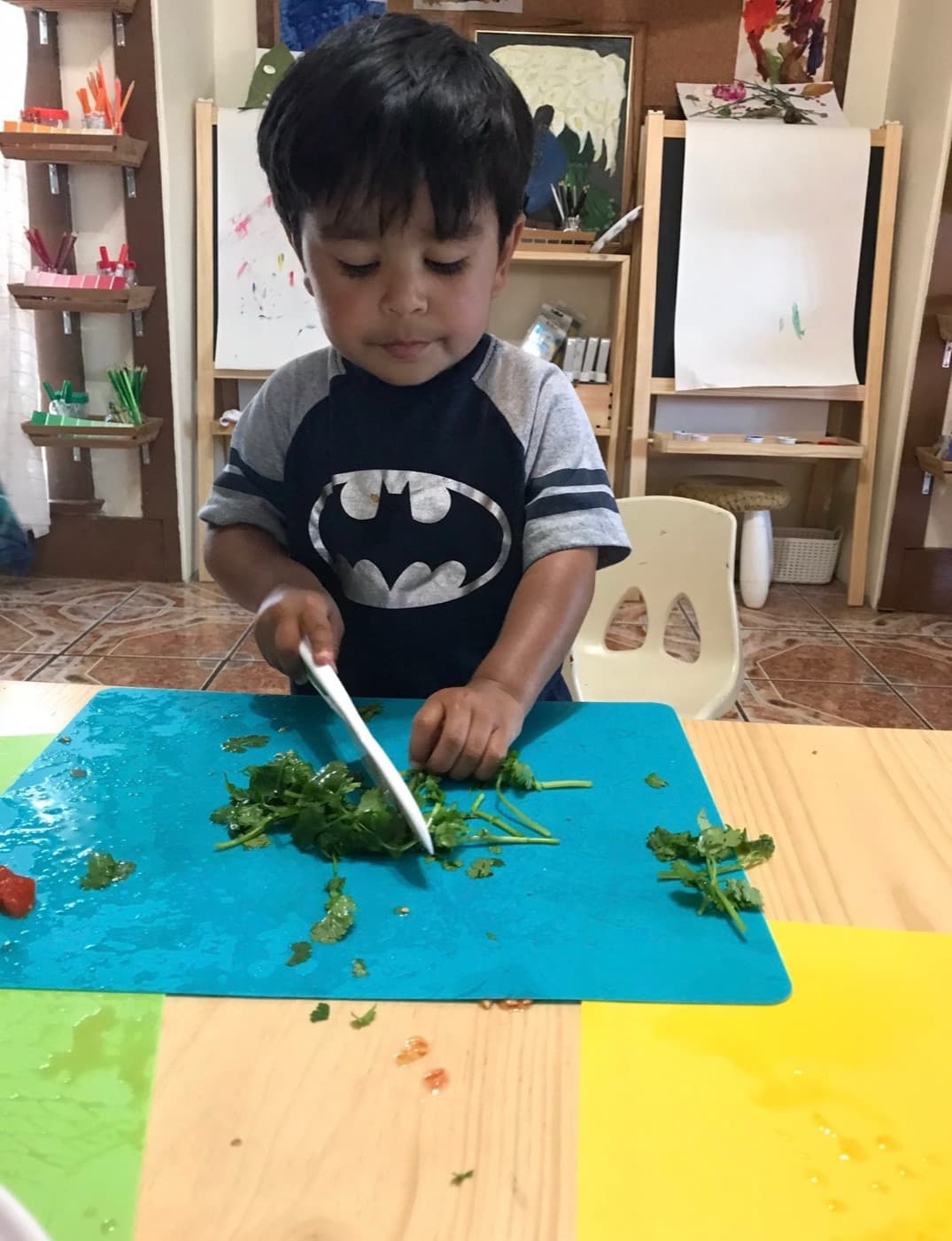 Chopping fresh cilantro with a kid-safe knife